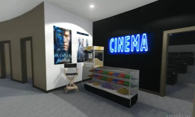 A movie theater with a chair and some movies