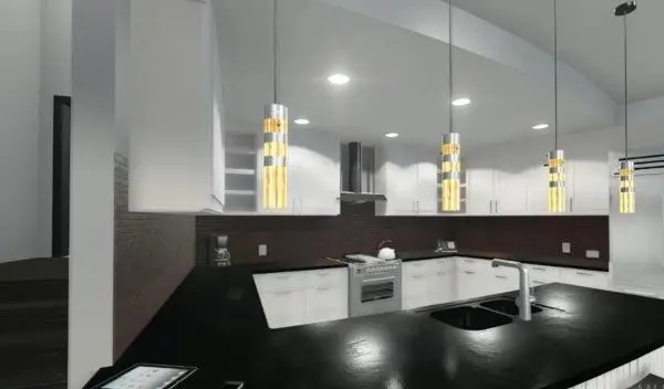 A kitchen with white walls and black counters.