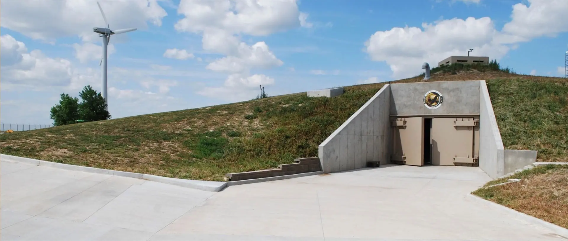 A concrete ramp on the side of a hill.